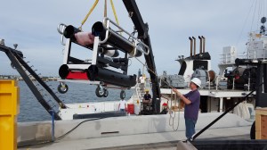 USM researcher Kevin Martin helps to lower the ISIIS onto the Pt. Sur